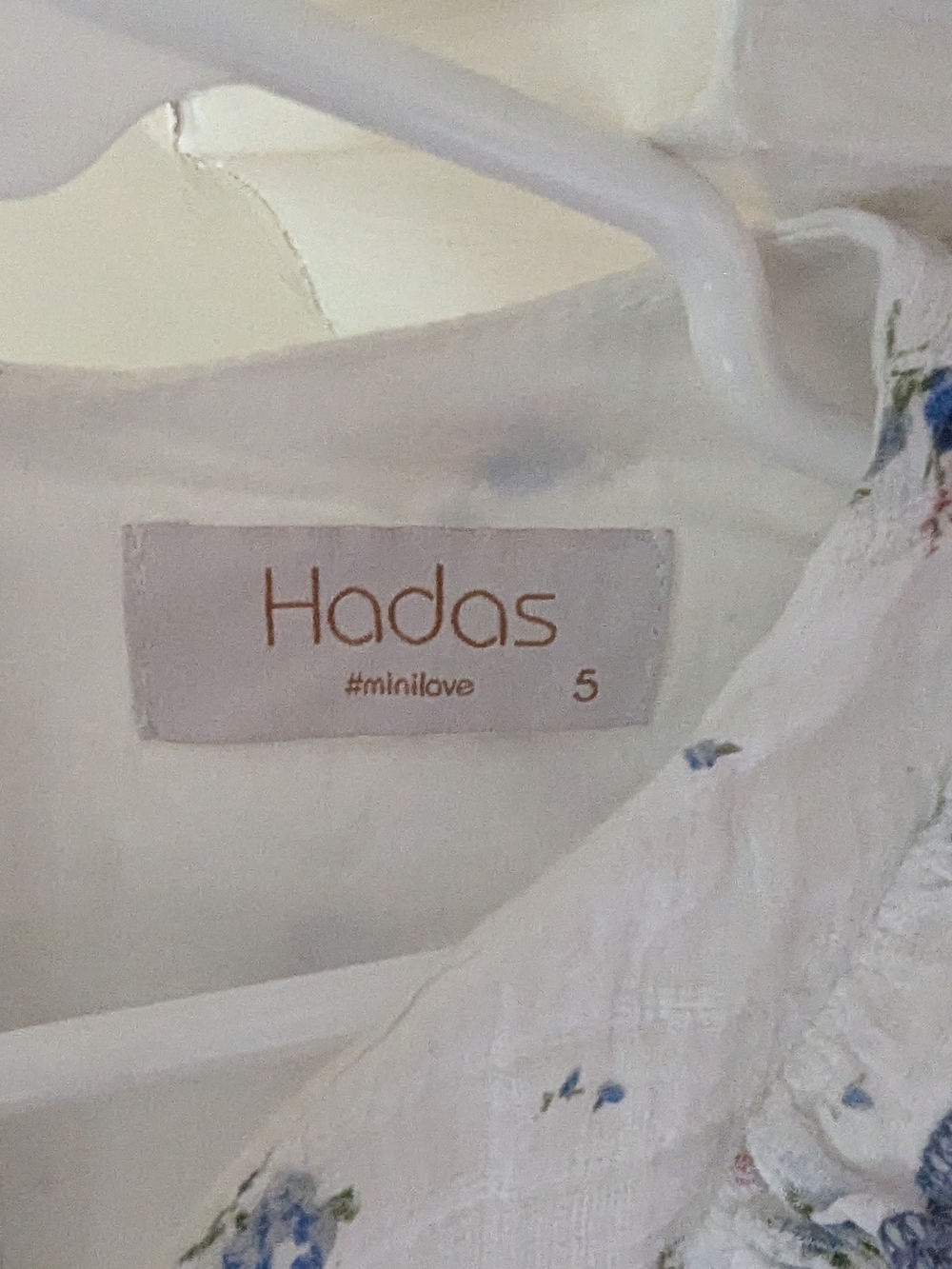 Hadas | White Floral Ruffle Baby Dress with Blue Trim - Picture 2 of 4